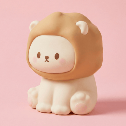 Cute lion-shaped squishy silicone night light with a soft brown mane sitting on a solid pink background.